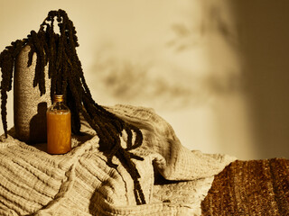 Summer suntan oil in brown tones still life