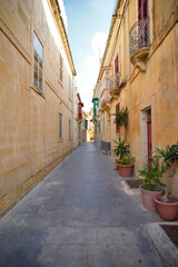 Fototapeta na wymiar Characteristic alley of Ir-Rabat, Gozo, Malta, super-wide angle