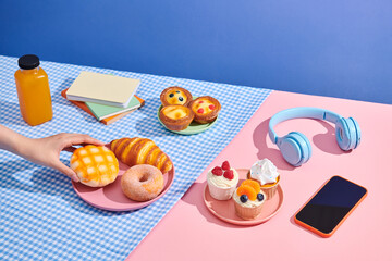 Headphones and coffee with croissants