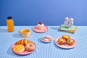 pastry and cupcake selection isolated on pink platter 