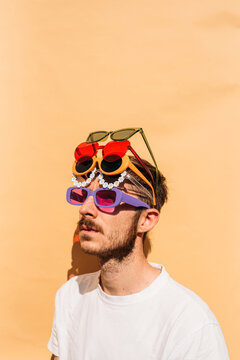 Boy and a bunch of sunglasses