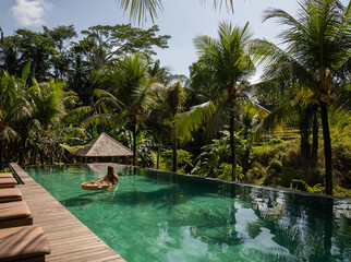Woman Holding Floating Breakfast In The Pool 