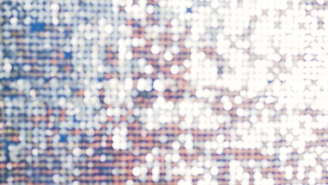 Silver mirror sequins sparkle and move in the wind, dynamic sparkling background