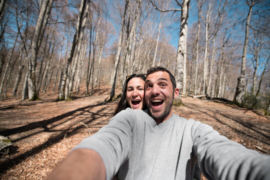 Excited couple selfie at the mountain