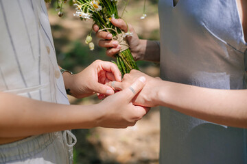 couple exchanging rings