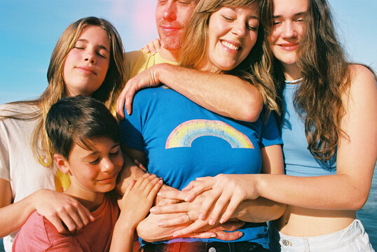 family portrait on beach and ocean in maui