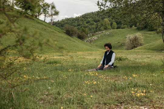 man praying salah in nature