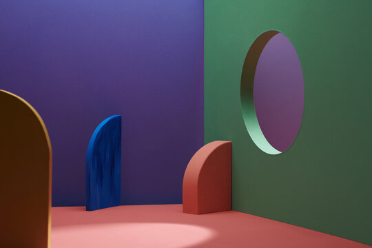 Against a color background, three geometric platforms
