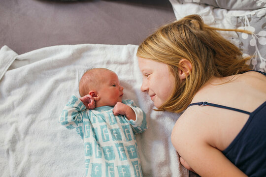 Girl with newborn baby 