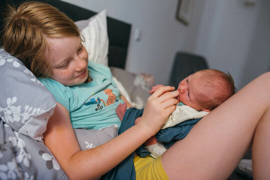 Girl with newborn baby 