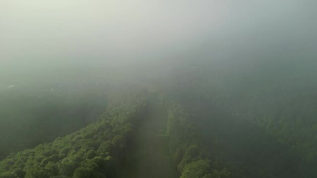The Carpathian Mountains captured by drone footage after rainfall, featuring a scenic landscape with clouds.
Azuga, Romania.