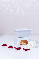 candle with flowers in spa