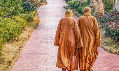 Back view of two Chinese female monks