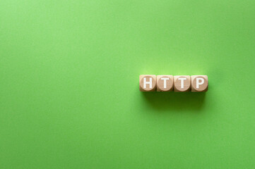 There is wood cube with the word HTTP. It is an abbreviation for Hyper Text Transfer Protocol as...