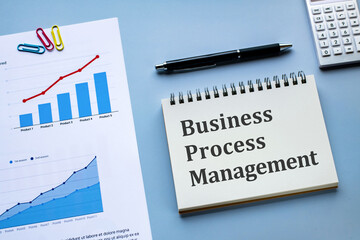 There is notebook with the word Business Process Management. It is as an eye-catching image.