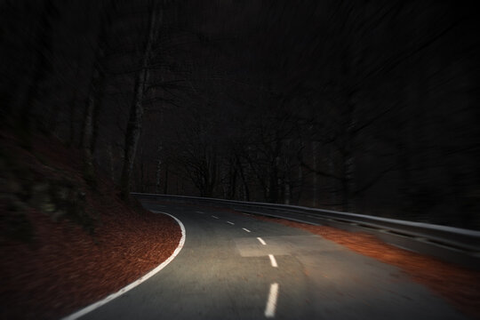 Fast night drive across mountain road