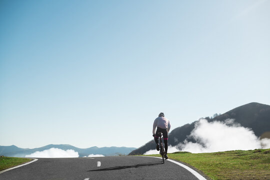Cyclist riding on the top of the mountain