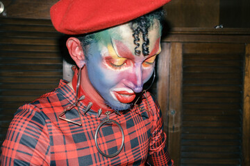 Vibrant Expression: Colorful and Artistic Drag Queen in Red Ensemble