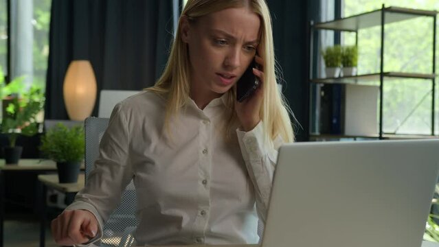 Multitasking annoyed stressed Caucasian businesswoman irritated business woman talk phone at office solve problem with laptop wrong documents project failure deadline turn off mobile difficult stress
