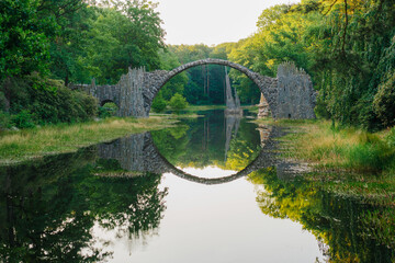 The Devil's bridge reflecting in the river 