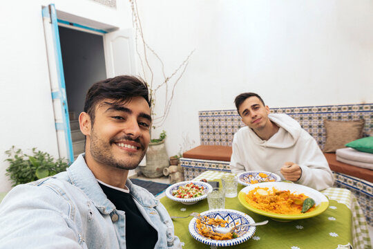 Selfie of friends eating Arabic food in Tunisia