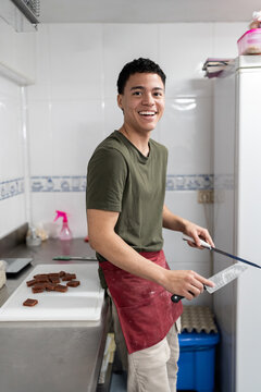 Man sharpening knife.