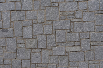 A wall of granite stones of different sizes