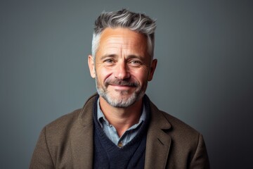 Obraz premium Portrait of a happy mature man with grey hair and beard.