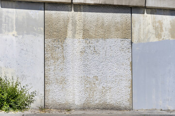A concrete wall with paint covering