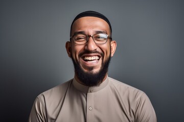 Fototapeta premium Portrait of a happy arabic man in eyeglasses