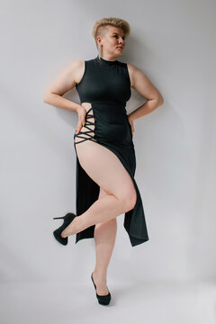 Sensual curvy blond woman in black dress