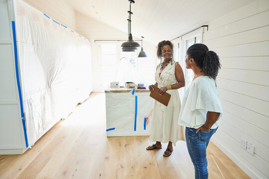 Black women client and real estate talking about purchase of new home