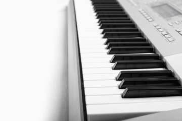 Fototapeta na wymiar Modern synthesizer keyboard isolated on white background, closeup