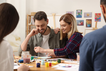 Fototapeta premium Group of students attending painting class in studio. Creative hobby
