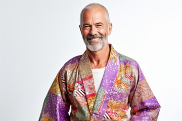 Portrait of a senior man wearing traditional kimono on white background