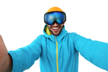 Smiling young man in ski goggles taking selfie on white background