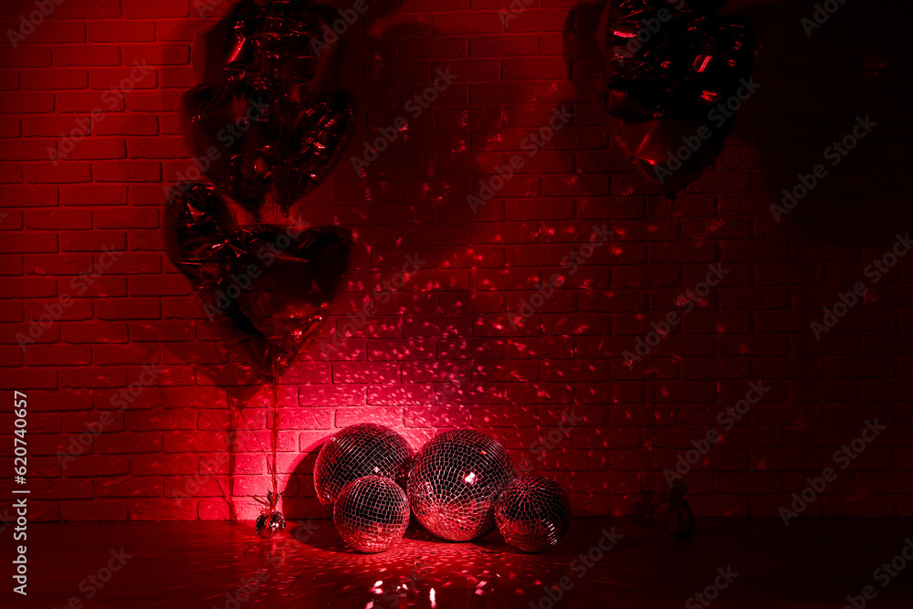 Sticker Many shiny disco balls in room decorated with heart shaped balloons, toned in red