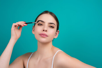 Mascara eyebrows. Natural beauty brows. Eyebrows coloring and lamination. Woman combing eyebrows. Makeup and cosmetology concept. Eyebrow shape modeling.