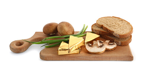 Board with triangles of tasty processed cheese in foil, mushrooms and bread pieces on white background