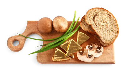 Board with triangles of tasty processed cheese in foil, mushrooms and bread pieces on white background