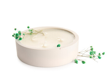 Holder with candle and gypsophila flowers on white background