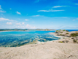 Fototapeta na wymiar Beautiful seascape with sandy beach and azure sea water in Lombok