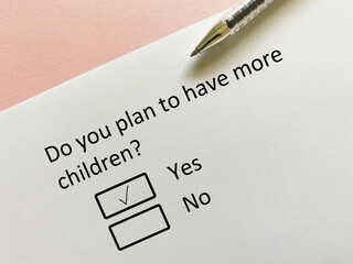 Fototapeta premium A person is answering question about finance. He plans to have more children.