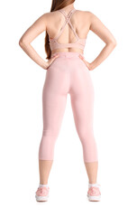 Fototapeta premium Young woman in sportswear on white background, back view