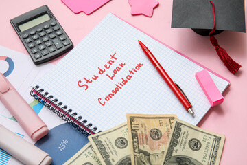 Notebook with text STUDENT LOAN CONSOLIDATION, graduation cap, calculator and dollar banknotes on pink background