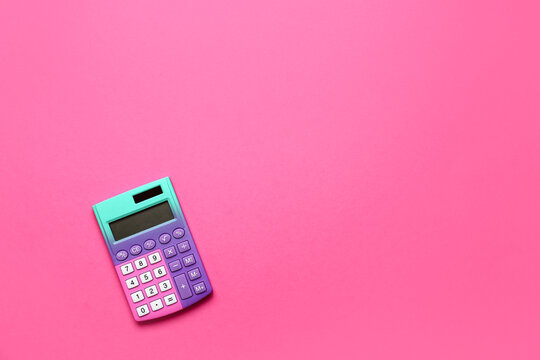 Modern calculator on pink background