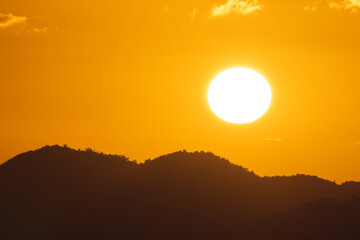 Golden sunset landscape with the sun above the mountains from puerto rico	 - Powered by Adobe