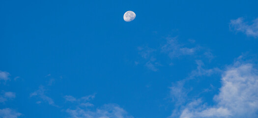The moon in the blue sky in the morning, natural background.