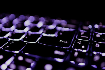 Backlit keyboard detail focusing Enter Key