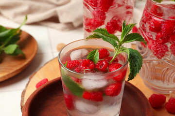 Glasses of fresh raspberry lemonade with mint on white background, closeup